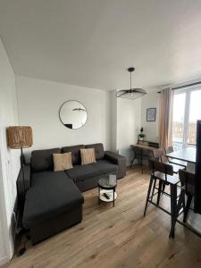 Un lugar para sentarse en Charmant appartement proche Paris et Stade de France !