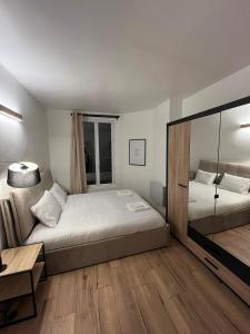 Una cama o camas en una habitación de Charmant appartement proche Paris et Stade de France !