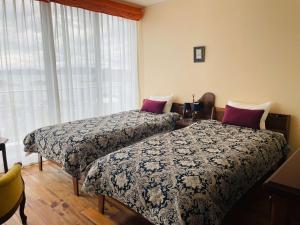 La Classe Angel Road 2 - Vacation STAY 71507v में एक कमरे में एक या कई बेड