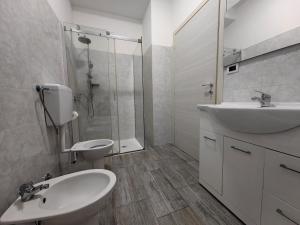 a bathroom with a sink and a toilet and a shower at MILANFORESTER in Milan