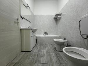 a bathroom with a toilet and a sink at MILANFORESTER in Milan