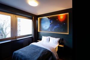 Кровать или кровати в номере Sleephotels Cosmos