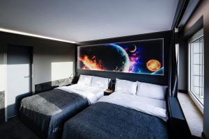 Кровать или кровати в номере Sleephotels Cosmos