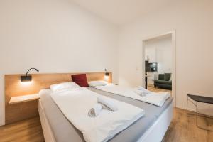 Voodi või voodid majutusasutuse myQuartier Central City Suites toas