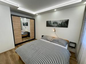 Una cama o camas en una habitación de Apartmány TWINS