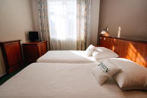 A bed or beds in a room at Union Hotel Prague