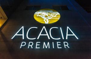 Et logo, certifikat, skilt eller en pris der bliver vist frem på Acacia Premier Hotel