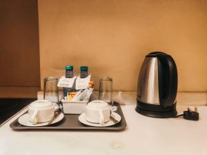 Fasilitas pembuat kopi dan teh di فندق فيلي للشقق الفندقية Filly Hotel Apartments