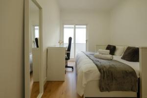 Tempat tidur dalam kamar di Apartamento T3 em Lisboa/ Queluz