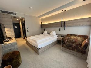 Giường trong phòng chung tại Bonfanti Design Hotel