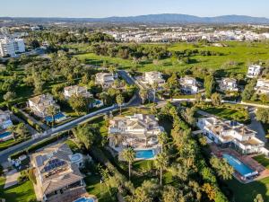 an aerial view of a villa with a resort at Alcore Luxury Golf Villa at Alto Golf Alvor in Alvor