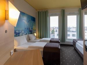 เตียงในห้องที่ B&B Hotel Fulda-City