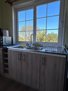 A kitchen or kitchenette at Cabañas Vista Volcanes II