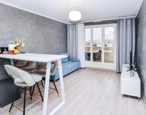 Un lugar para sentarse en Appartement moderne, proche du Parc de la tête d'Or et de Lyon