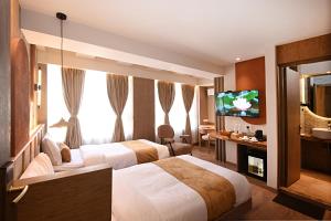 Cama ou camas em um quarto em Daali Hotel & Apartment