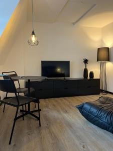 A television and/or entertainment centre at Studiowohnung 5 in Buxtehude