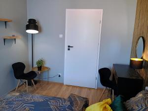 En eller flere senger på et rom på Apartament EM