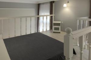 A bed or beds in a room at S2 Apartman