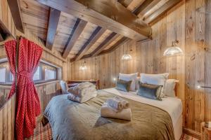 Krevet ili kreveti u jedinici u okviru objekta Hotel & Spa Le Val d'Isère