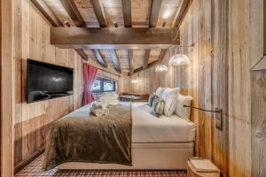 Krevet ili kreveti u jedinici u okviru objekta Hotel & Spa Le Val d'Isère