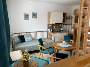 a living room with a couch and a table at Samoobslužný hotel Vydra in Srní