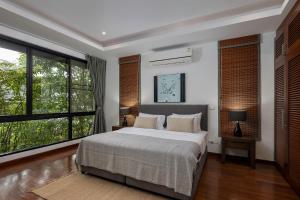 Cama ou camas em um quarto em Villa Decor