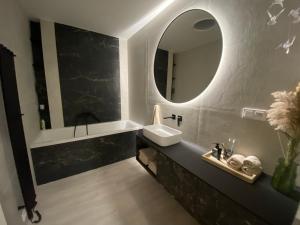 a bathroom with a sink and a mirror at Loft Vrchlabí in Vrchlabí