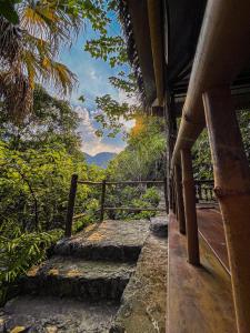 a stairway leading up to a house with a view at Trang An Lamia Bungalow in Ninh Binh