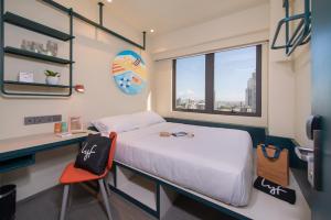 Cama ou camas em um quarto em lyf Cebu City - Managed by The Ascott Limited