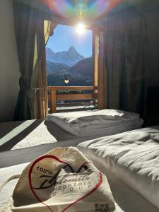 Krevet ili kreveti u jedinici u objektu Dolomiti Lodge Villa Gaia