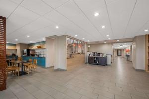 a large room with a kitchen and a dining room at Country Inn & Suites by Radisson, Fredericksburg South I-95 , VA in Fredericksburg