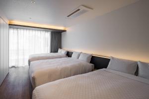 Posteľ alebo postele v izbe v ubytovaní Hotel Dios - Vacation STAY 31239v