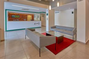 אזור ישיבה ב-City Express Junior by Marriott Puebla FINSA