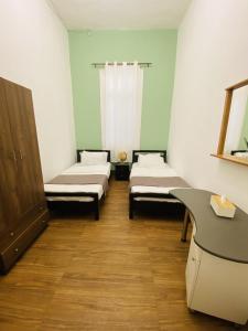 City Hostel Dormitory tesisinde bir odada yatak veya yataklar