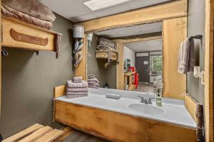 a bathroom with a large sink and a mirror at Stonegate Lodge 2 Queen Beds Fast WiFi 50in TV Salt Water Pool Room # 305 in Eureka Springs