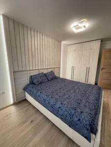 Posteľ alebo postele v izbe v ubytovaní Cozy Retreat Apartment