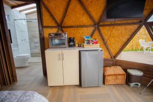 Кухня или мини-кухня в Glamping Monteverde San gil
