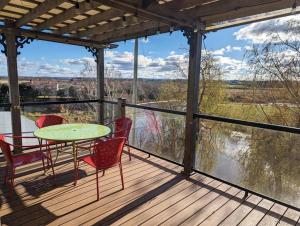 A balcony or terrace at Beautiful River View Apt in Wine Country