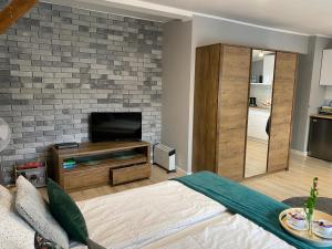 Телевизор и/или развлекательный центр в Apartament Blue Lagoon