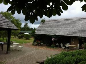 a house with a table and chairs and a roof at Chill Inn in Bernāti