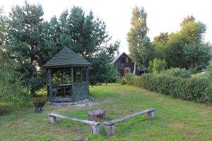 a gazebo in the middle of a yard at Chill Inn in Bernāti