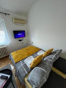 Posteľ alebo postele v izbe v ubytovaní Apartman Stevan