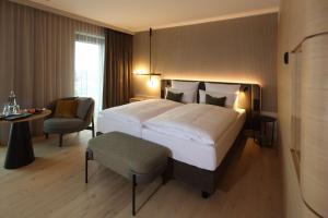 Cama ou camas em um quarto em ATLANTIC Hotel Heidelberg