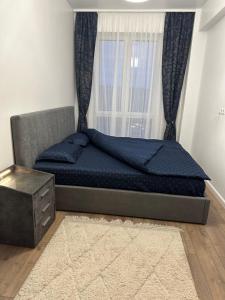 Postelja oz. postelje v sobi nastanitve Apartament lângă VIVO