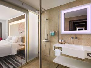 A bathroom at Novotel Jakarta Gajah Mada