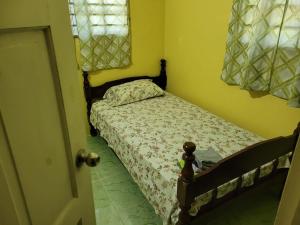 Cama ou camas em um quarto em Tim's & Mag's Home Stay