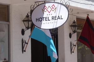 Et logo, certifikat, skilt eller en pris der bliver vist frem på Hotel REAL CAFAYATE