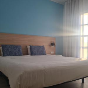 Tempat tidur dalam kamar di Flag Hotel Santarém