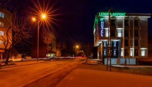 a building with a sign on it on a street at night at Lenora Airport Hotel & İstanbul Airport in Arnavutköy