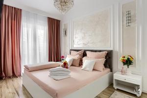 Krevet ili kreveti u jedinici u objektu Sika Garden Apartment Arad